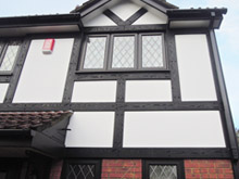 Black tudor board with white render board replacement
